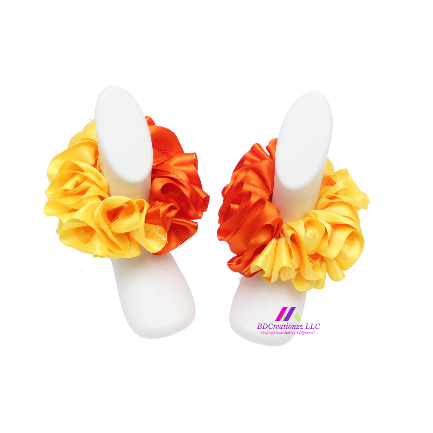 Detachable ruffles on orange and yellow baby socks, customizable and playful accessory