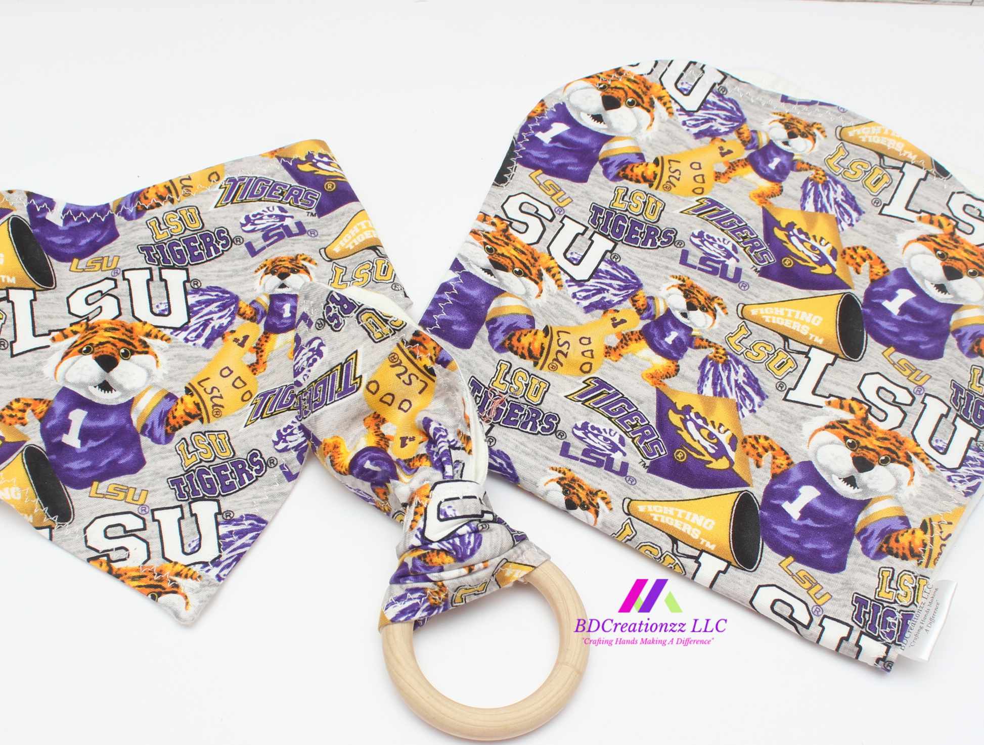 Purple and gold football print baby bib, burp cloth and wooden teether gift set.