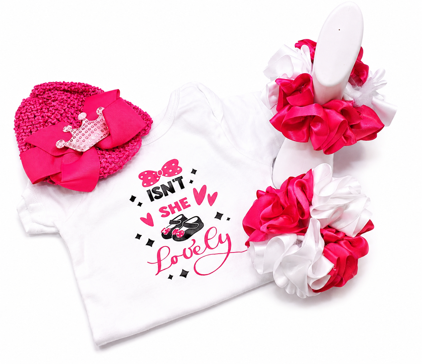 White baby outfit with pink and white headband and ruffled pants on a white background