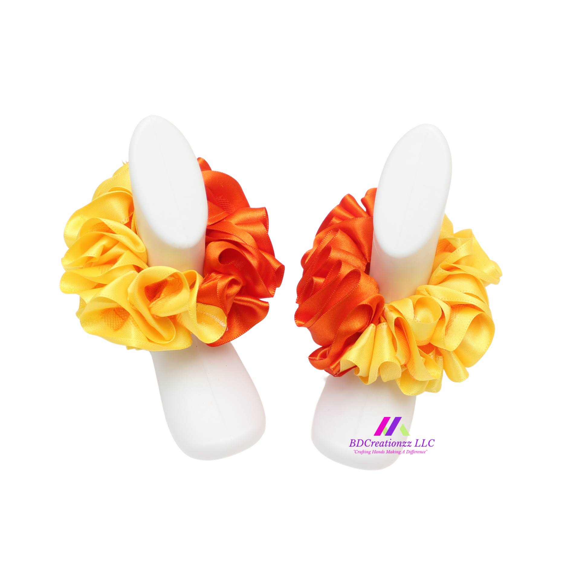 Detachable ruffles on orange and yellow baby socks, customizable and playful accessory
