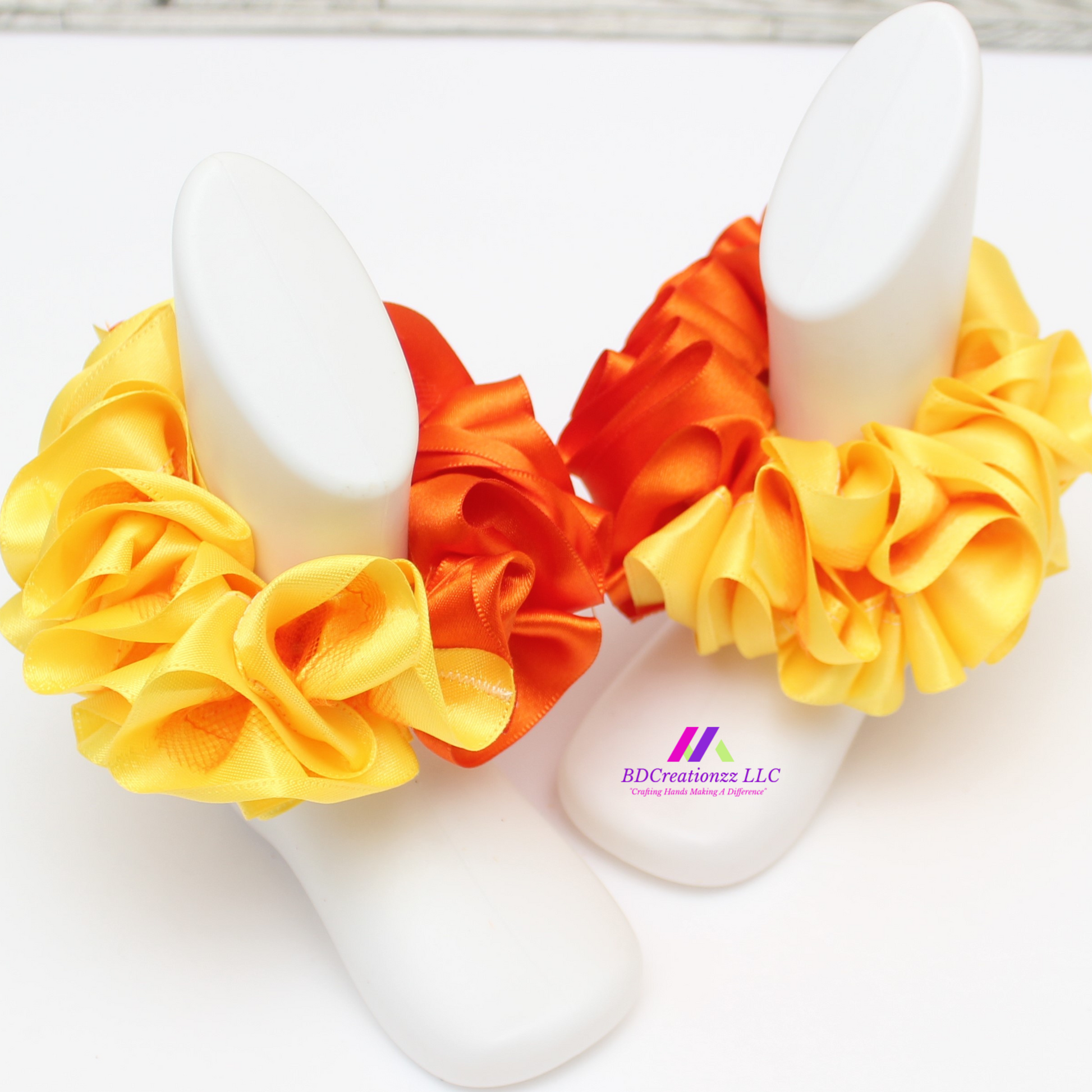 Gift-ready orange and yellow detachable ruffle socks for babies, soft, cozy, and colorful